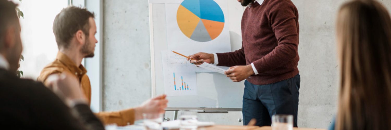 side-view-man-doing-presentation-during-meeting